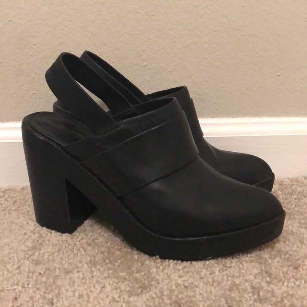 Intentionally blank black heeled mules